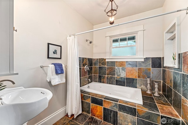 746 N 89th St, Seattle, WA 98103 - full bath featuring a sink, baseboards, and tiled shower / bath combo
