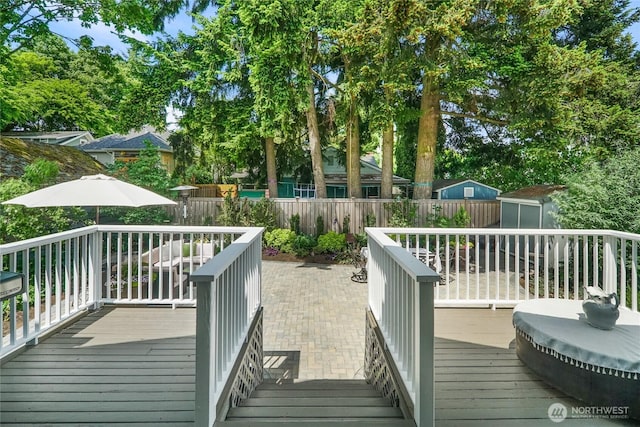 746 N 89th St, Seattle, WA 98103 - wooden deck with a fenced backyard and view of scattered trees