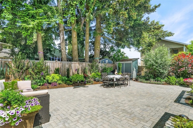 746 N 89th St, Seattle, WA 98103 - fenced backyard featuring outdoor dining space and a patio