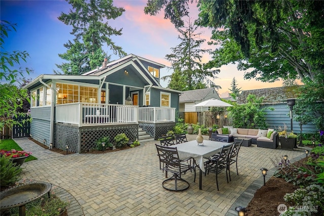 746 N 89th St, Seattle, WA 98103 - back of property with outdoor lounge area, a fenced backyard, a patio area, a wooden deck, and stairway