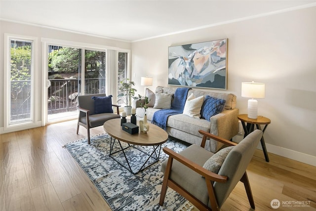 1016 6th Ave N Unit 102, Seattle, WA 98109 - living room featuring baseboards, wood finished floors, and crown molding