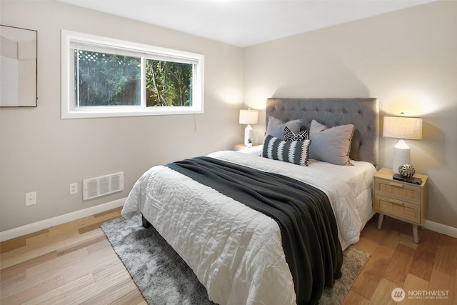 1016 6th Ave N Unit 102, Seattle, WA 98109 - bedroom featuring baseboards and wood finished floors