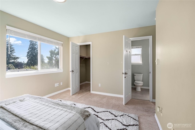12408 1st Ave SW, Seattle, WA 98146 - unfurnished bedroom featuring light colored carpet, baseboards, and a spacious closet