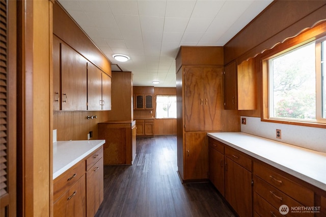 1122 G St, Centralia, WA 98531 - kitchen with brown cabinets, light countertops, dark wood-type flooring, and a heating unit