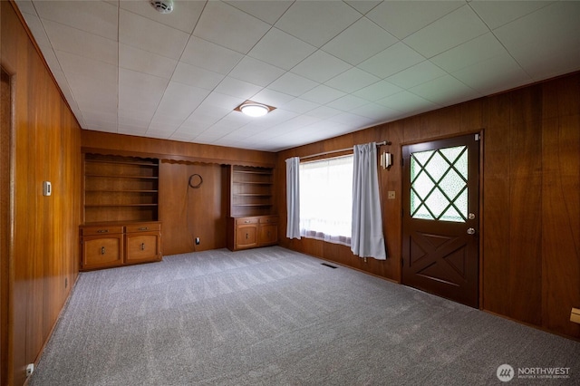1122 G St, Centralia, WA 98531 - foyer featuring wood walls and light carpet