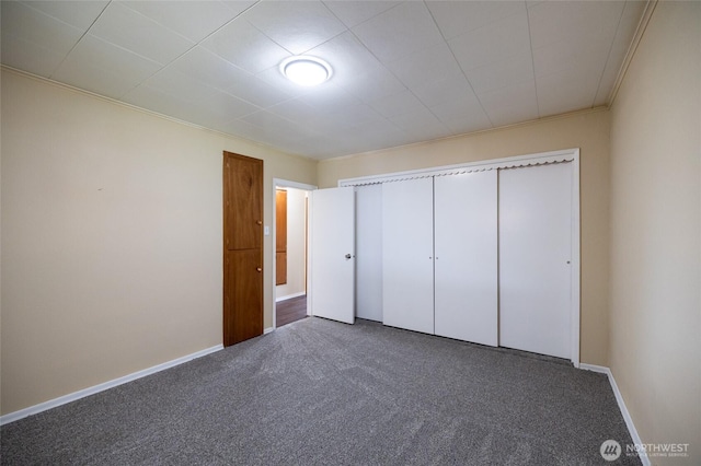 1122 G St, Centralia, WA 98531 - unfurnished bedroom with carpet, ornamental molding, a closet, and baseboards