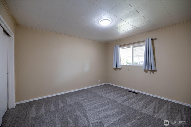 1122 G St, Centralia, WA 98531 - unfurnished bedroom with carpet flooring, a closet, crown molding, and baseboards