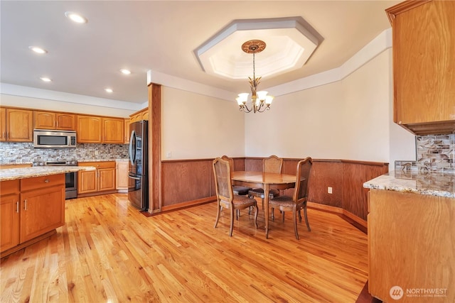 31637 107th Ave SE, Auburn, WA 98092 - dining room with a chandelier, light wood-style floors, wainscoting, and recessed lighting