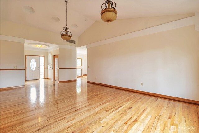 31637 107th Ave SE, Auburn, WA 98092 - empty room featuring light wood-style flooring, baseboards, and high vaulted ceiling