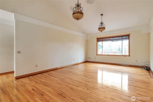 31637 107th Ave SE, Auburn, WA 98092 - unfurnished room with light wood finished floors, vaulted ceiling, and baseboards
