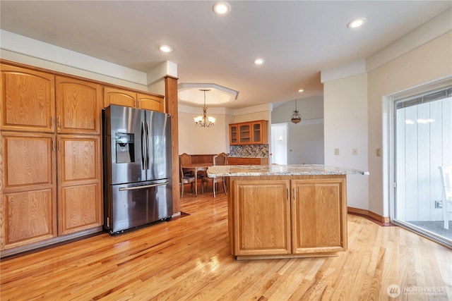 31637 107th Ave SE, Auburn, WA 98092 - kitchen featuring stainless steel fridge, light wood-style floors, a center island, backsplash, and recessed lighting