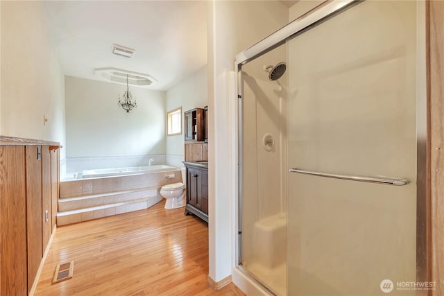 31637 107th Ave SE, Auburn, WA 98092 - bathroom with a stall shower, wood finished floors, a bath, and vanity