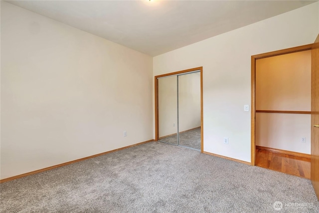 31637 107th Ave SE, Auburn, WA 98092 - unfurnished bedroom featuring carpet floors, baseboards, and a closet
