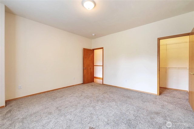31637 107th Ave SE, Auburn, WA 98092 - unfurnished bedroom with carpet flooring, baseboards, and a closet