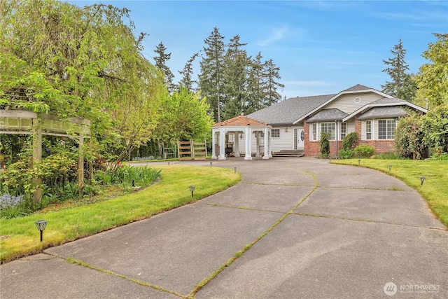31637 107th Ave SE, Auburn, WA 98092 - view of front of house with a front lawn, brick siding, and driveway