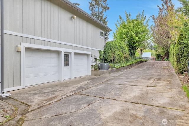 31637 107th Ave SE, Auburn, WA 98092 - view of property exterior with concrete driveway, central AC unit, and a garage
