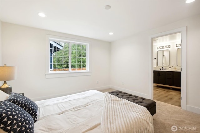 3598 Breeze Way NW, Bremerton, WA 98312 - carpeted bedroom featuring baseboards, recessed lighting, ensuite bath, and a sink
