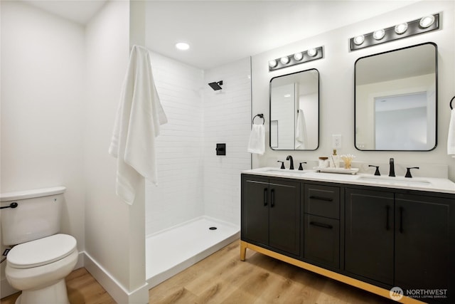 3598 Breeze Way NW, Bremerton, WA 98312 - full bath with wood finished floors, toilet, double vanity, a tile shower, and recessed lighting