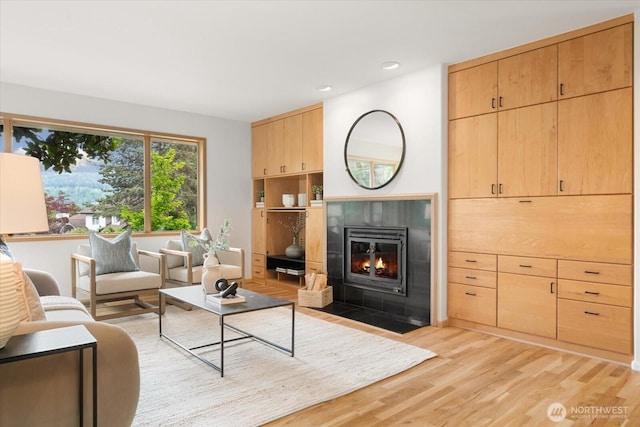 4102 205th Ave SE, Sammamish, WA 98075 - living room featuring light wood-style flooring, a fireplace, and recessed lighting