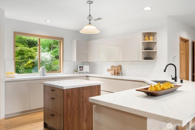 4102 205th Ave SE, Sammamish, WA 98075 - kitchen with open shelves, a peninsula, modern cabinets, tasteful backsplash, and recessed lighting