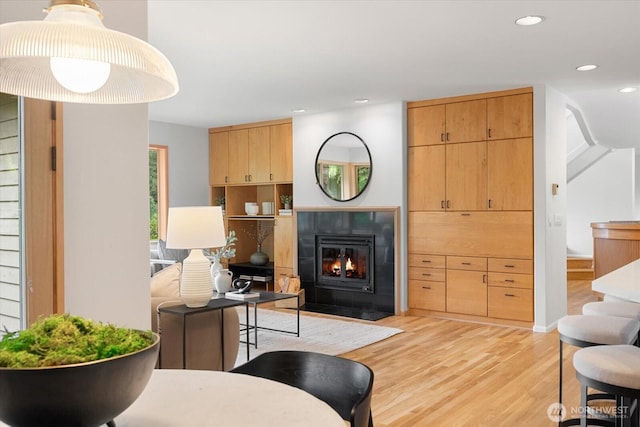 4102 205th Ave SE, Sammamish, WA 98075 - living room featuring light wood finished floors, recessed lighting, and a fireplace