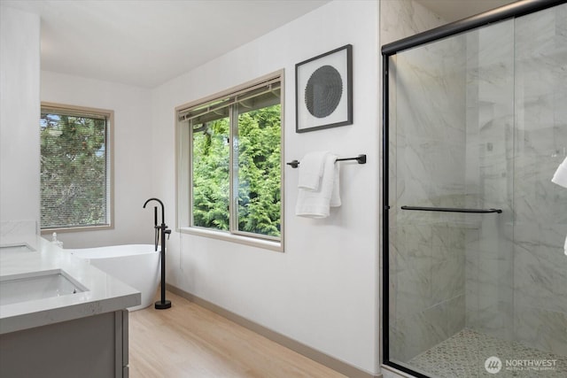 4102 205th Ave SE, Sammamish, WA 98075 - bathroom with a marble finish shower, plenty of natural light, and a soaking tub