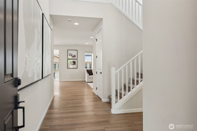 20307 145th St E Unit 860, Bonney Lake, WA 98391 - hallway with stairs, wood finished floors, recessed lighting, and baseboards