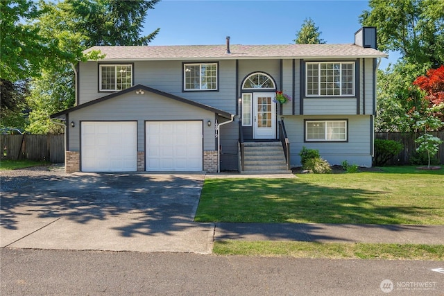 12012 140th Street Ct E, Puyallup, WA 98374 - bi-level home featuring a chimney, driveway, an attached garage, and brick siding
