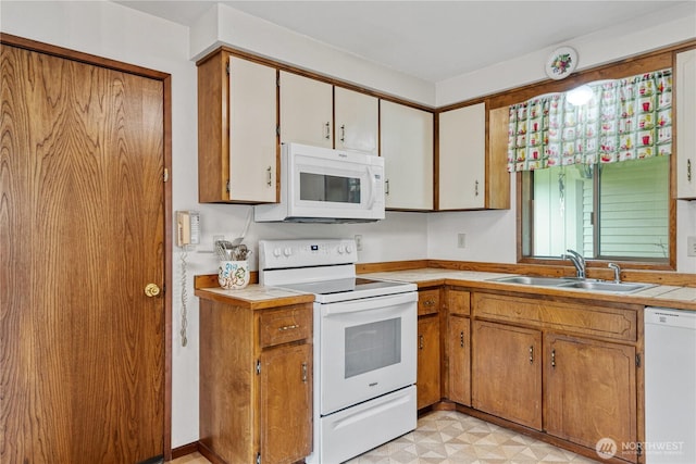 2412 Mulberry St, Longview, WA 98632 - kitchen with white appliances, a sink, light countertops, and light floors