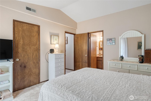 2412 Mulberry St, Longview, WA 98632 - bedroom with vaulted ceiling, light colored carpet, and connected bathroom
