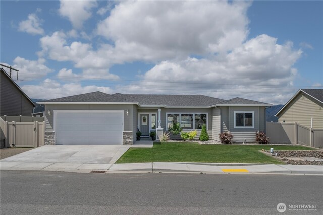 28 S Millbrook, East Wenatchee, WA 98802 - single story home with an attached garage, driveway, a gate, and a shingled roof