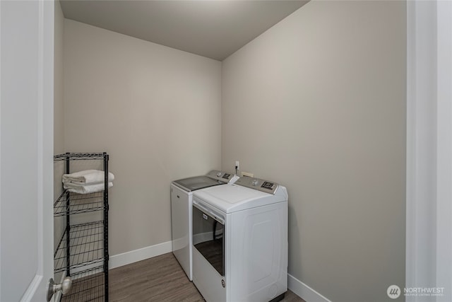 28 S Millbrook, East Wenatchee, WA 98802 - washroom with washer and dryer, wood finished floors, and baseboards