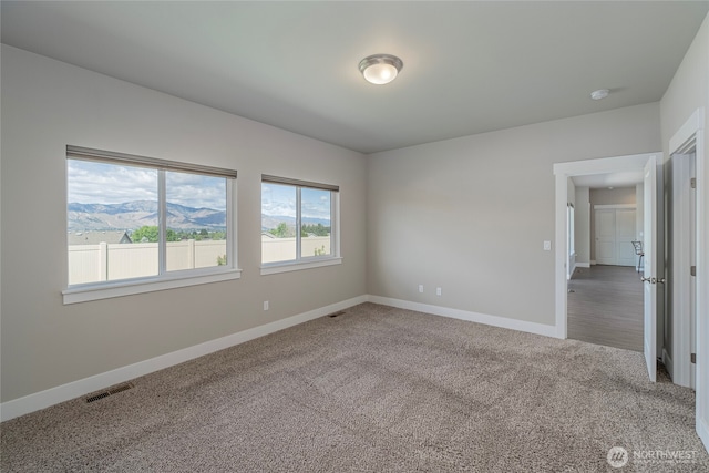 28 S Millbrook, East Wenatchee, WA 98802 - empty room with carpet, baseboards, and a smoke detector