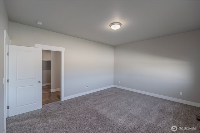 28 S Millbrook, East Wenatchee, WA 98802 - carpeted spare room with baseboards and a smoke detector