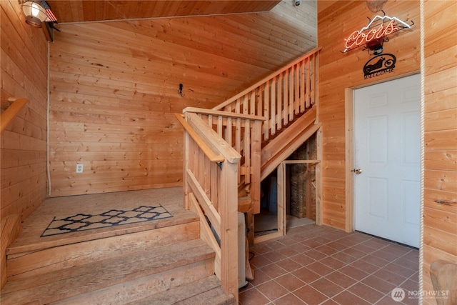645 Chelan Trails Rd, Chelan, WA 98816 - stairs featuring wooden walls, wood ceiling, and tile patterned flooring