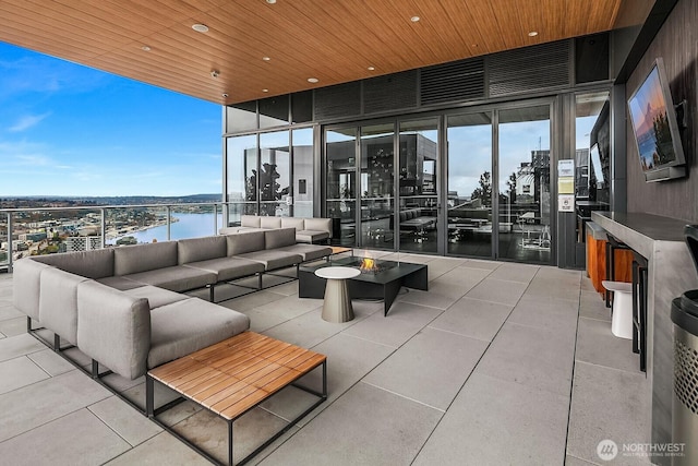 1808 Minor Ave Unit 912, Seattle, WA 98101 - view of patio with an outdoor living space and a water view