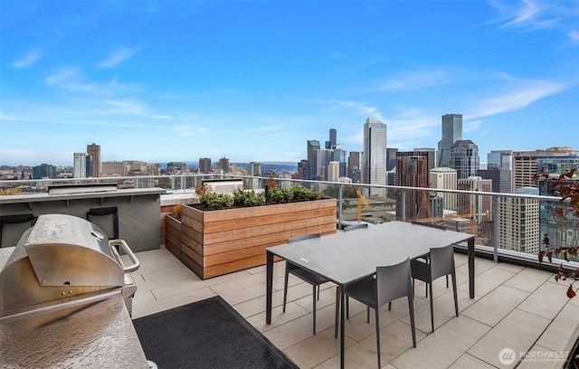 1808 Minor Ave Unit 912, Seattle, WA 98101 - view of patio / terrace with a view of skyline, grilling area, and a balcony