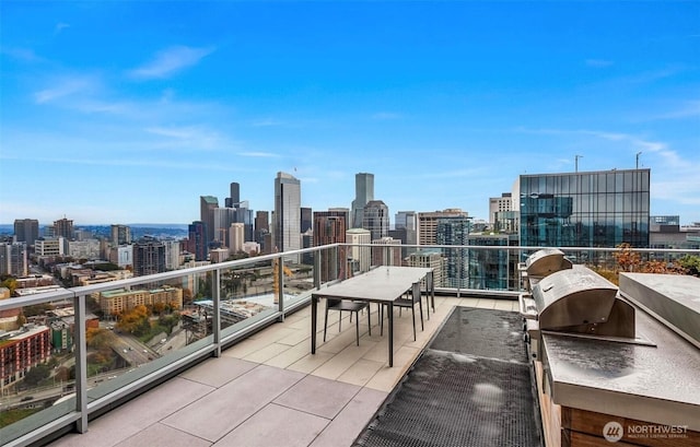 1808 Minor Ave Unit 912, Seattle, WA 98101 - balcony with a view of skyline and exterior kitchen