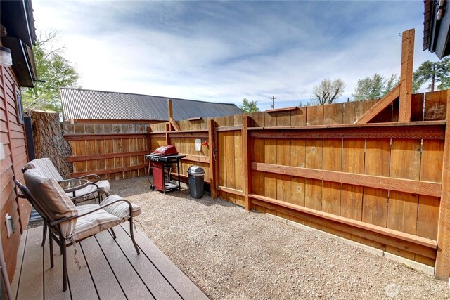 115 Johnson St N Unit 1, 2, 3, Twisp, WA 98856 - wooden terrace featuring a fenced backyard and area for grilling