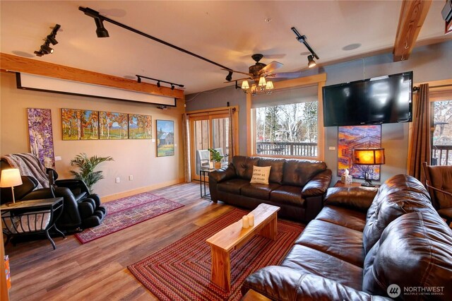 115 Johnson St N Unit 1, 2, 3, Twisp, WA 98856 - living room with track lighting, wood finished floors, ceiling fan, and baseboards