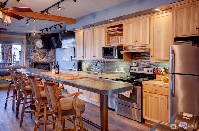 115 Johnson St N Unit 1, 2, 3, Twisp, WA 98856 - kitchen with appliances with stainless steel finishes, a sink, rail lighting, under cabinet range hood, and light brown cabinets