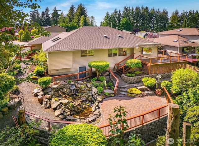 14431 Cascade Dr SE, Snohomish, WA 98296 - back of house with a deck and crawl space