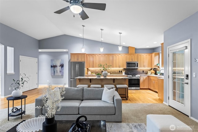 10810 63rd Ave NW, Gig Harbor, WA 98332 - living room featuring light wood-style floors, ceiling fan, and high vaulted ceiling