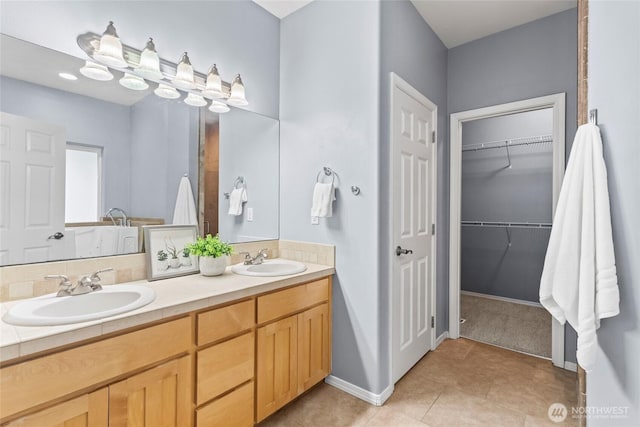10810 63rd Ave NW, Gig Harbor, WA 98332 - full bath with tile patterned flooring, double vanity, a spacious closet, and baseboards