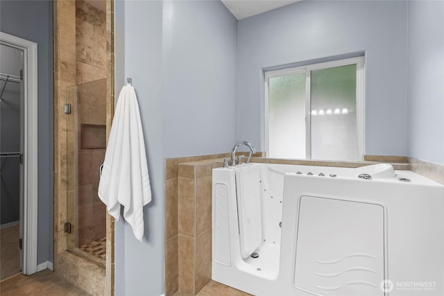 10810 63rd Ave NW, Gig Harbor, WA 98332 - bathroom with a stall shower, a walk in closet, and a garden tub