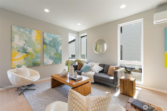 1801 NW 65th St Unit C, Seattle, WA 98117 - living room with a wall mounted AC, wood finished floors, baseboards, and recessed lighting