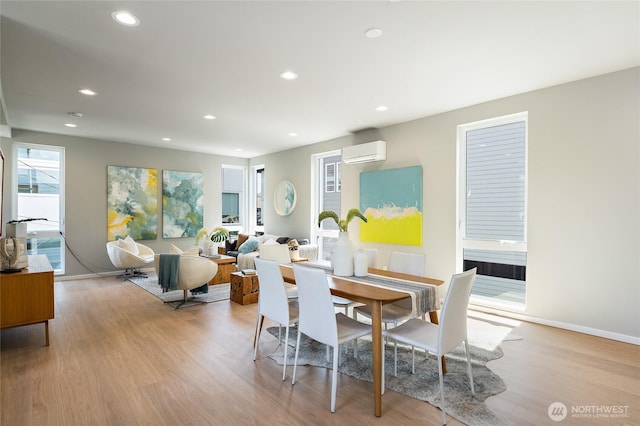 1801 NW 65th St Unit C, Seattle, WA 98117 - dining area with a wall mounted AC, light wood finished floors, recessed lighting, and baseboards