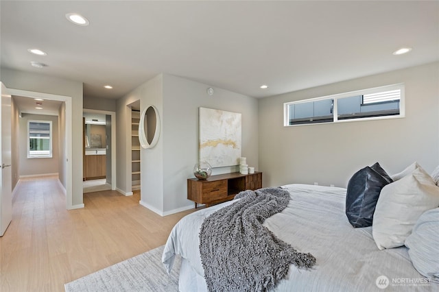 1801 NW 65th St Unit C, Seattle, WA 98117 - bedroom featuring multiple windows, light wood finished floors, recessed lighting, and baseboards