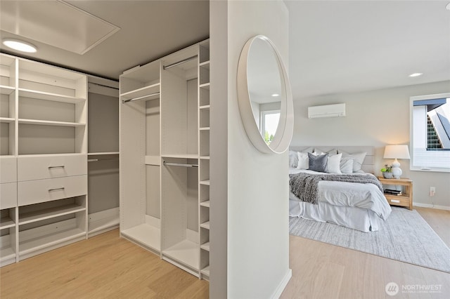 1801 NW 65th St Unit C, Seattle, WA 98117 - walk in closet featuring wood finished floors and a wall mounted AC