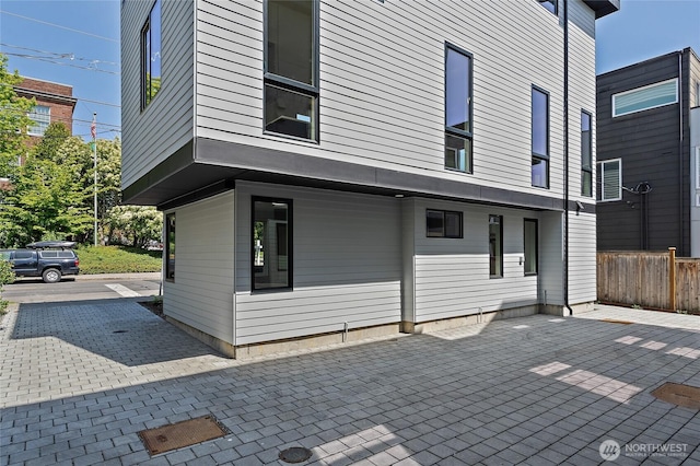 1801 NW 65th St Unit C, Seattle, WA 98117 - back of property with fence and a patio area